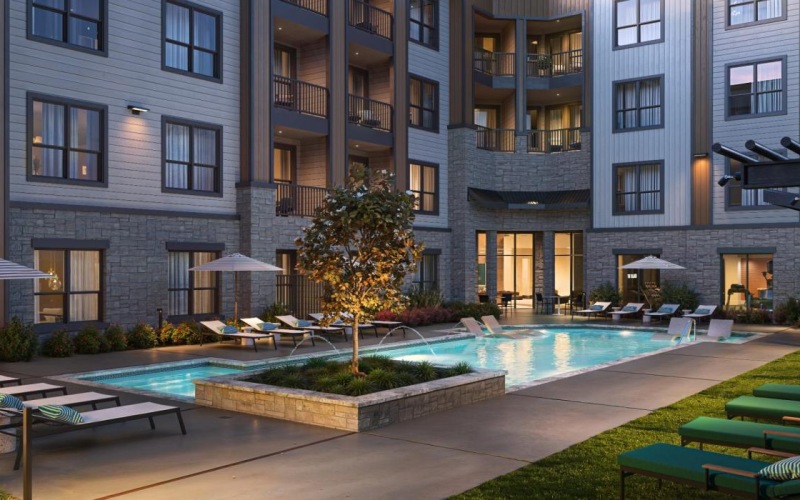 a pool in a courtyard between buildings