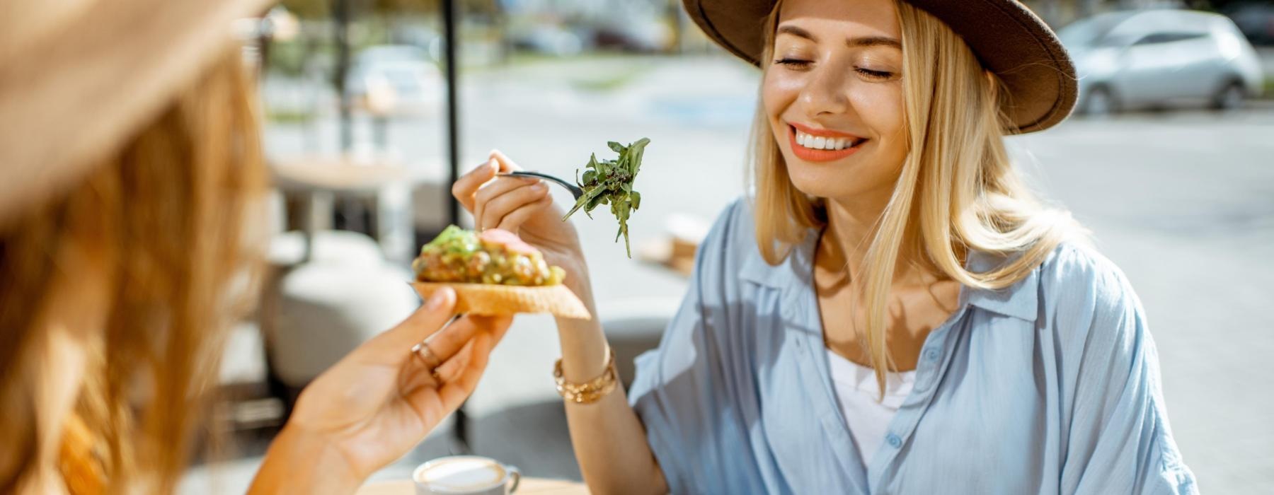 a woman and a girl eating food